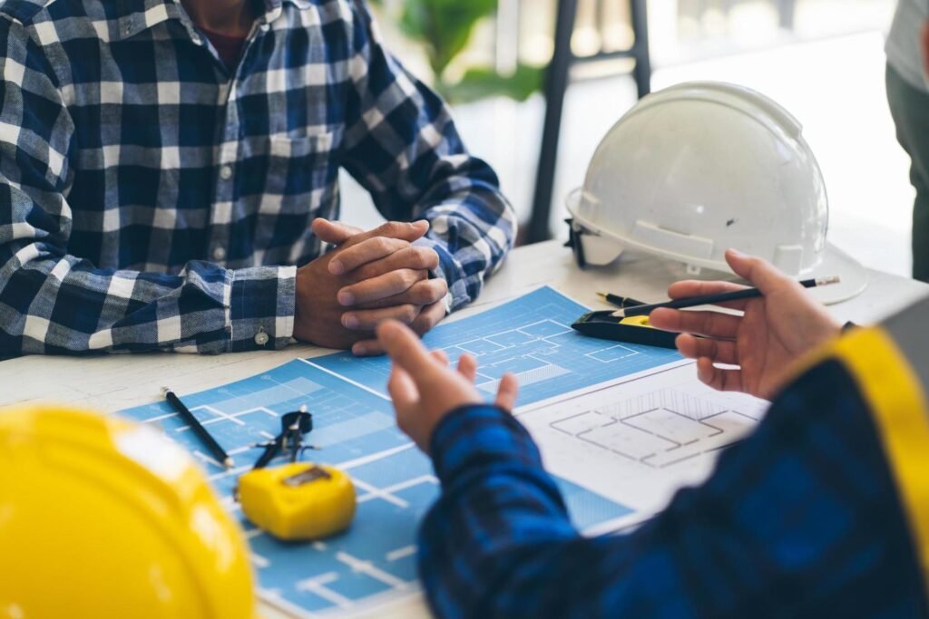 engineer-teamwork-meeting-drawing-working-on-blueprint-meeting-for-project-working-with-partner-on-model-building-and-engineering-tools-in-working-site-construction-and-structure-co
